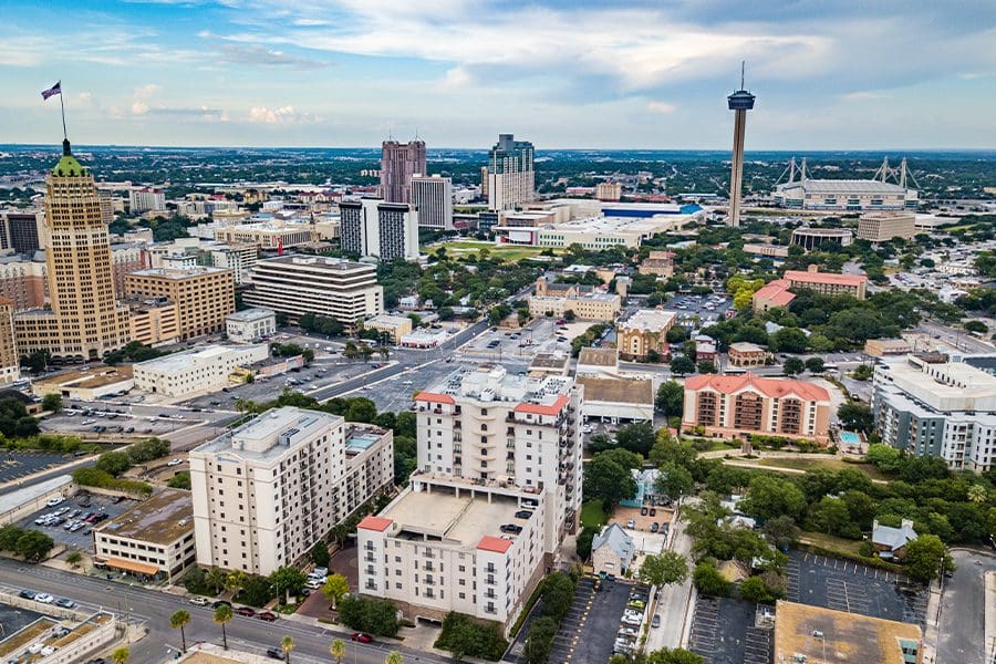 Contact - Aerial View of San Antonio, Texas and Surrounding Communities on a Sunny Day