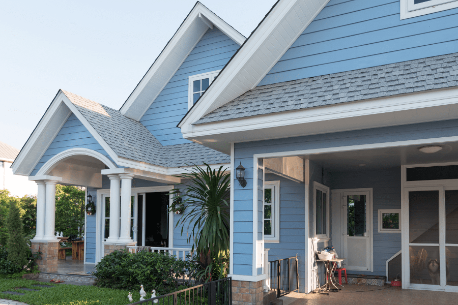 Image of a blue house with white trim for BDI's Homeowners Insurance Coverage
